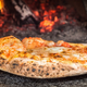 Imagen para el artículo titulado Un pizzero gana dinero comprándose pizzas a sí mismo en una app de reparto con descuento